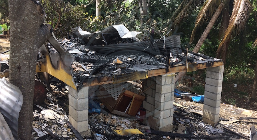 The charred remnants of the house that Cherry-Ann Smith and her son called home.