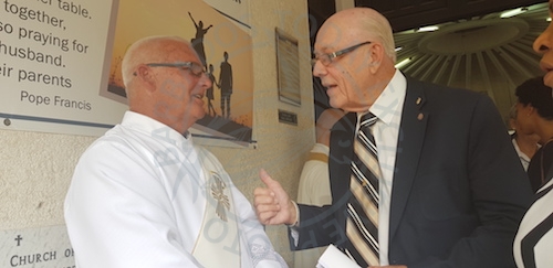 Sir Henry Fraser (right), in conversation with Deacon Stephen Foster of St Dominic’s Roman Catholic Church, where he eulogised his friend Dr Frances Chandler today.