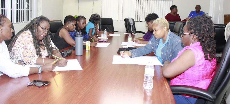 Members of the counting panel tallying the votes.