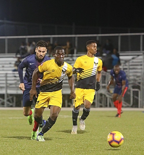 (From left) Alvin Chapman and Tremaine Cobham scored a goal each for UWI who had a comfortable win over Empire Club.