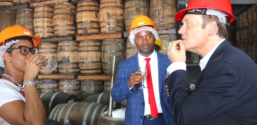 Owner of West Indies Rum Distillery Ltd Alexandre Gabriel (right) explains the testing process of the rum as Chairperson of the Port Senator Lisa Cummins and Minister of Maritime Affairs and the Blue Economy Kirk Humphrey do their taste testing.