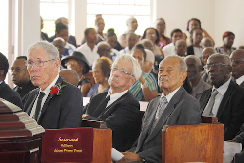 Businessman Ralph “Bizzy” Williams (left, at front), his brother Sir Charles Williams (left in the second row), and former Cabinet Minister and Deputy Prime Minister Sir Philip Greaves (right in the second row), at Major Sam Headley’s funeral service.