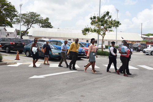 A group of union officials filing into the CXC building to engage in talks that would eventually prove futile.