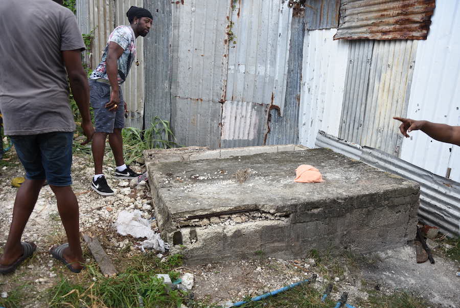 A resident looking into the 100-feet well into which Kyrique Boyce fell.
