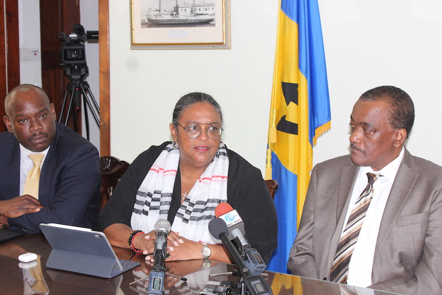 Prime Minister Mia Mottley (centre) flanked by Minister in the Ministry of Finance Ryan Straughn (left) and Minister of Health Lt. Col. Jeffrey Bostic during today’s press conference.