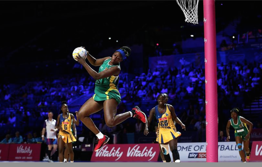 Zimbabwe’s Pauline Jani jumps to take this catch as Barbados’ Amanda Knight (left) and Rhe-ann Niles-Mapp (second right) follow the play.