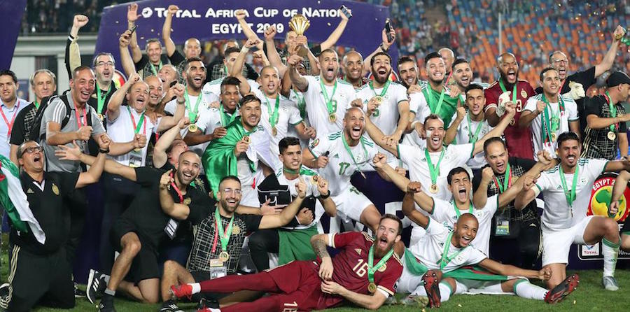 Algeria celebrate after winning the Africa Cup of Nations title in Cairo today with a 1-0 victory over Senegal. (See full story on pages 46 & 47)