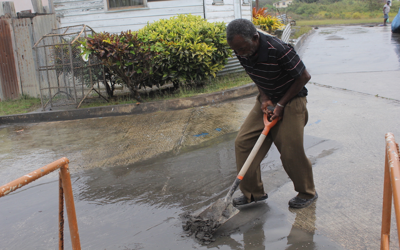 Barbadians, heeding Govt call, clean up from ashfall - Barbados Today