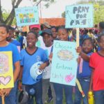 Schools unite with police in anti-violence march through Bridgetown