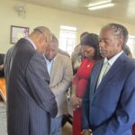 Bishop Atherley prays with three St Michael Central candidates, (L) DLP's Andre Worrell, (C) BLP's Tyra Trotman and (FOB) Raymond Wiggins