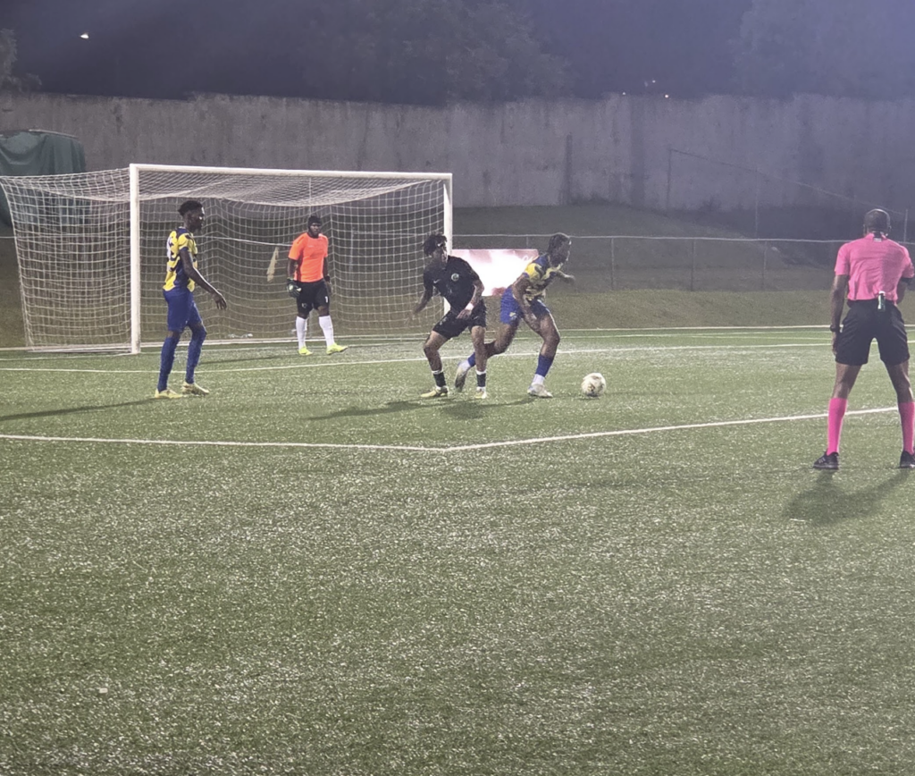 Table leaders battle back to draw with defending champions